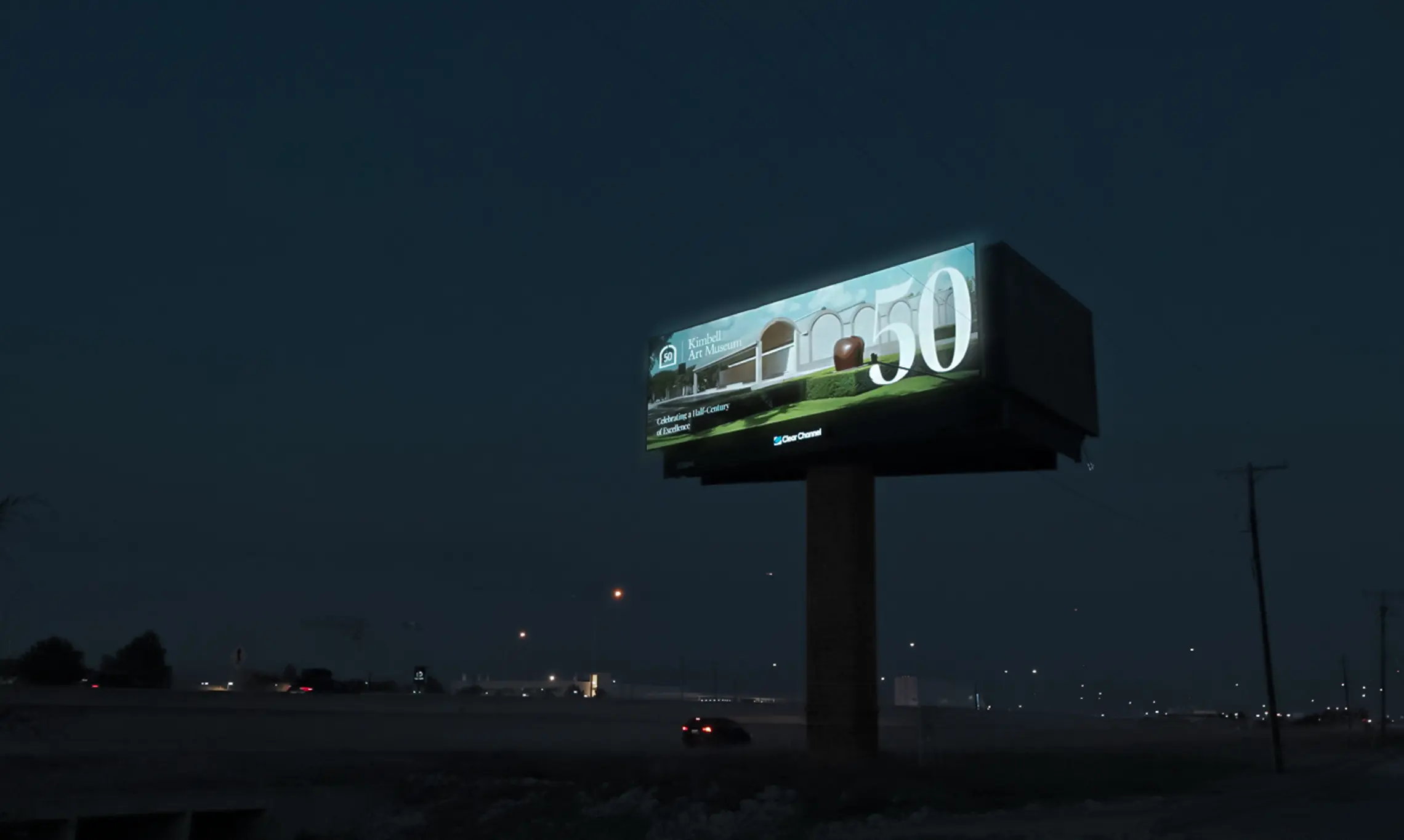 A digital billboard displaying an ad for the Kimbell Art Museum’s 50th Anniversary exhibition